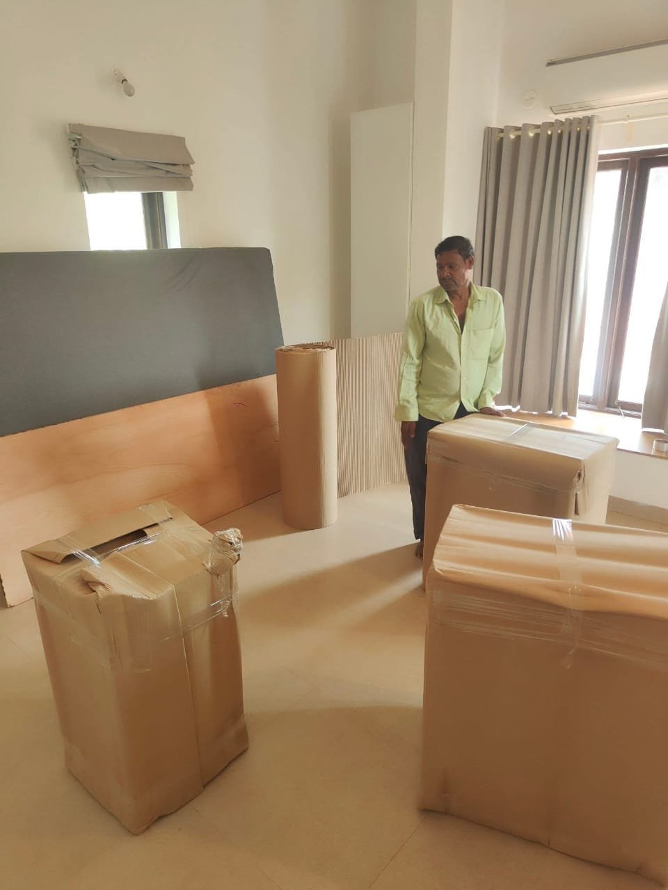 Expert team member handling packed boxes with care